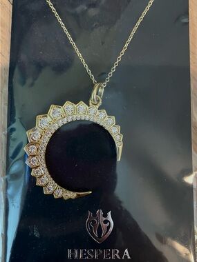 Hespera Gold-Tone Crescent Pendant Necklace with White Stones